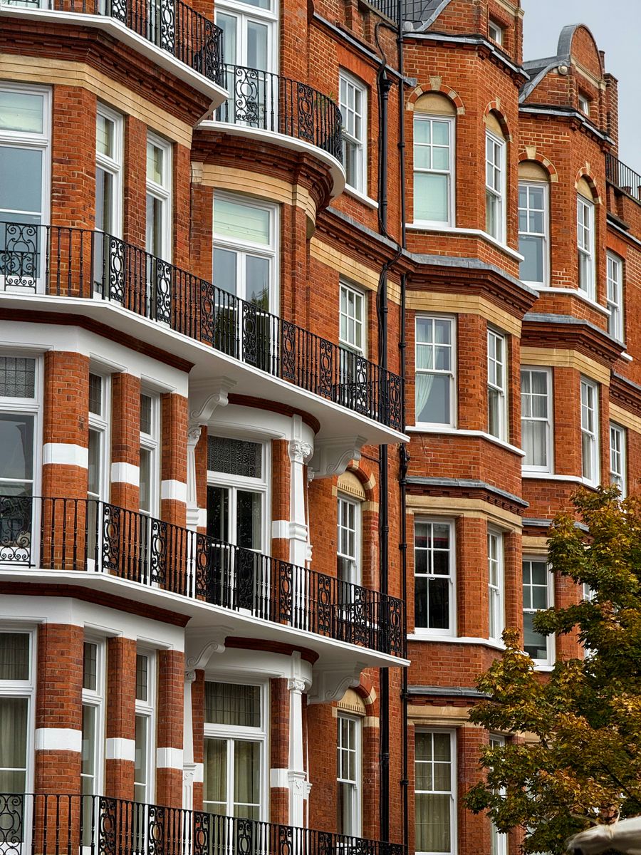 Red brick period homes on a street in Kensington, London