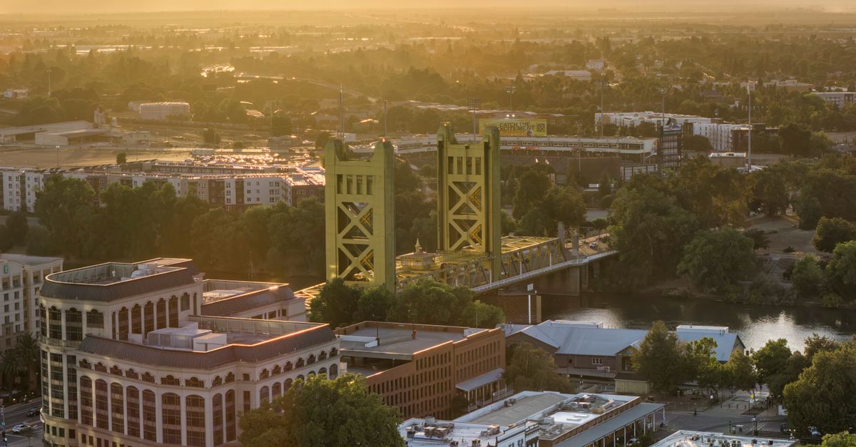 Stunning aerial view of Sacramento's iconic Tower Bridge at sunset, highlighting the city's vibrant skyline.