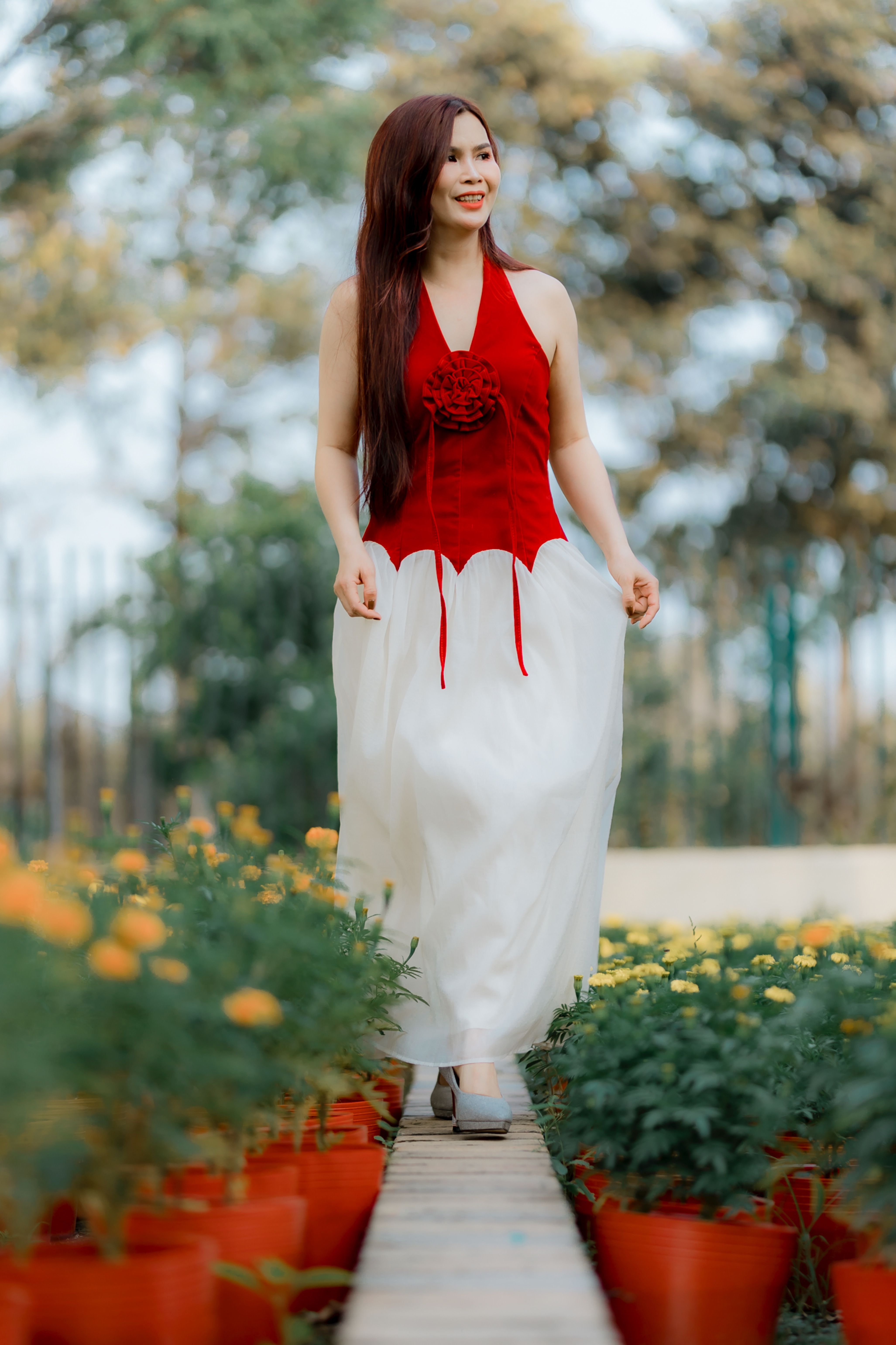 Woman in Red Top Sitting on a Water Well · Free Stock Photo
