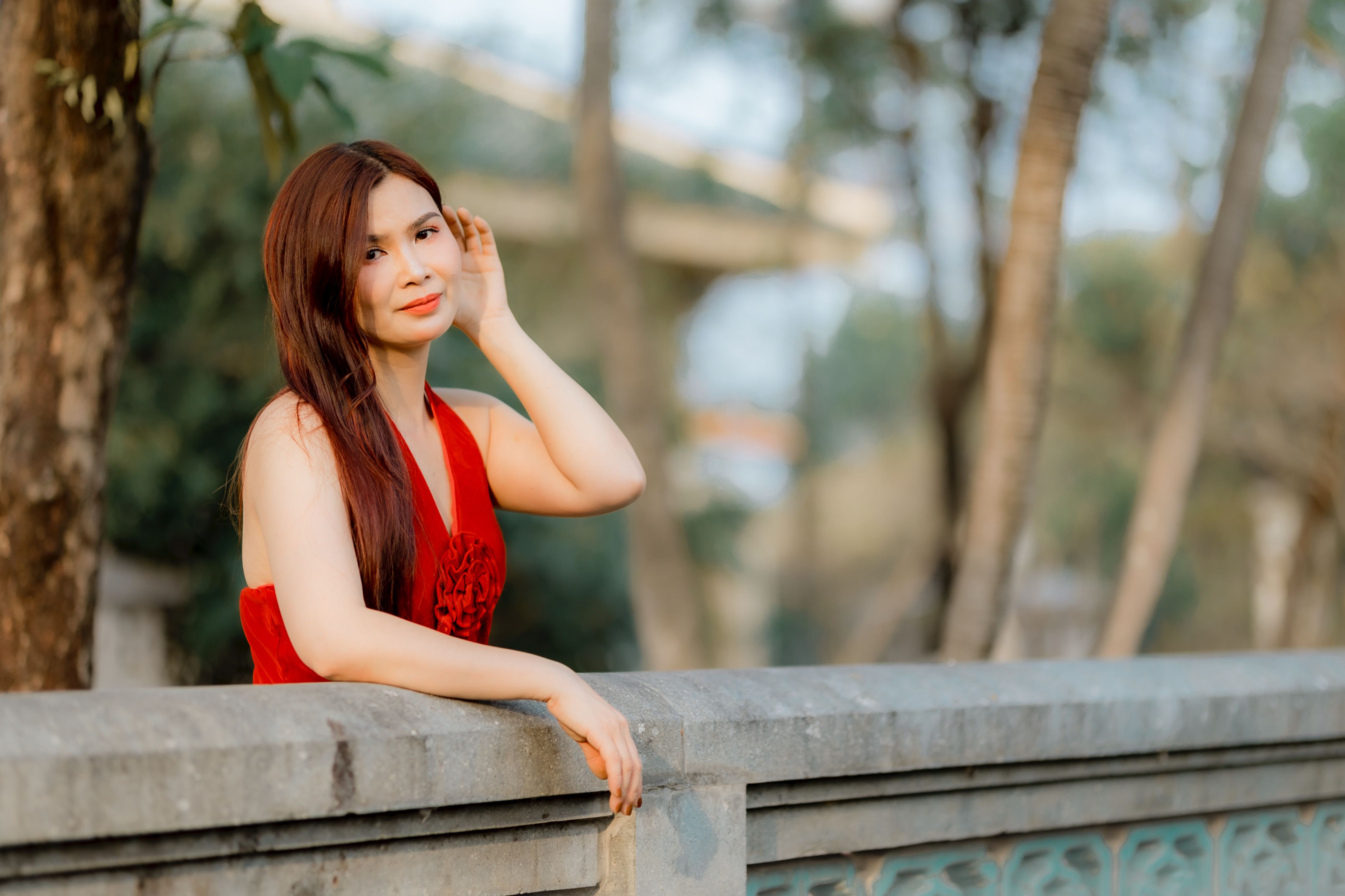 Elegant Woman in Red Dress Outdoors · Free Stock Photo