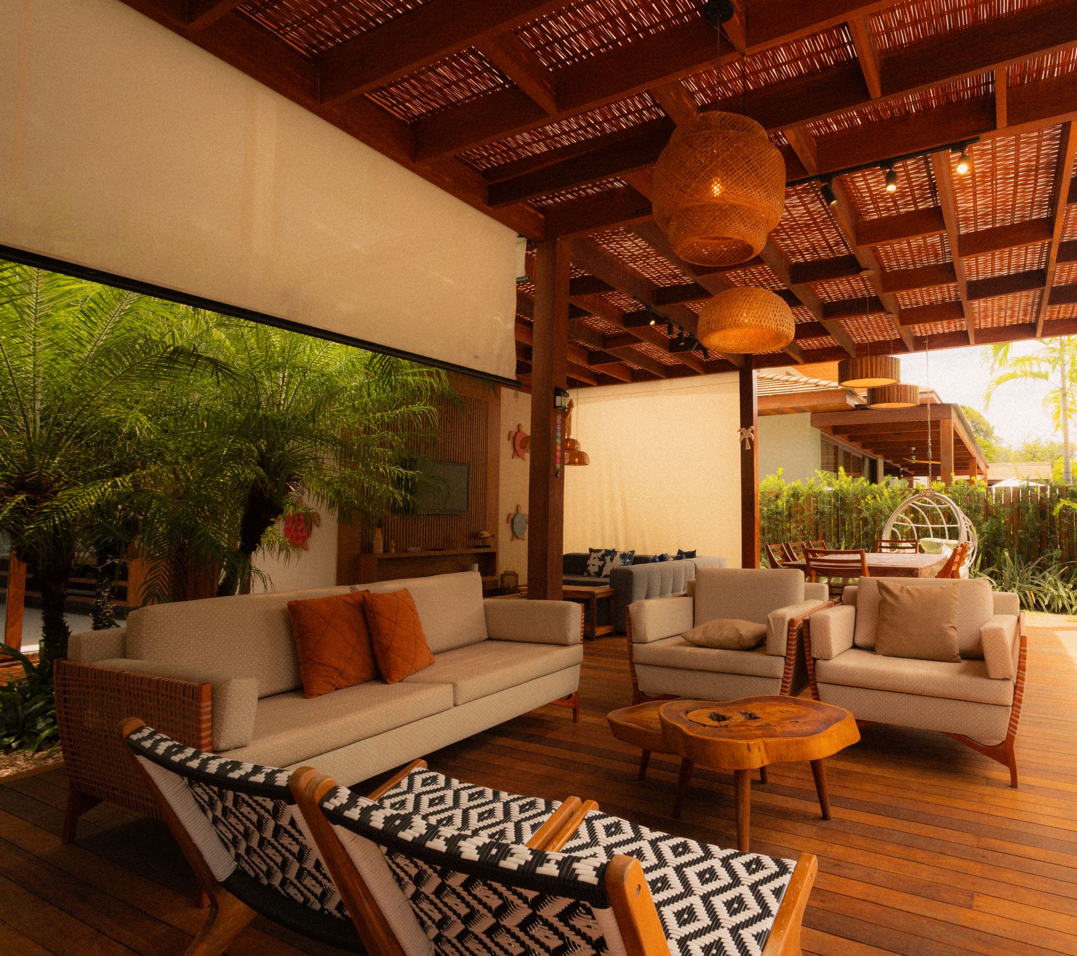 Wide shot — covered pergola lounge