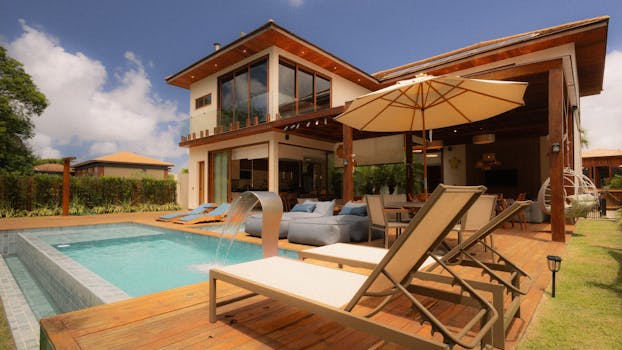 Elegant villa featuring a private pool and sun loungers for ultimate relaxation.
