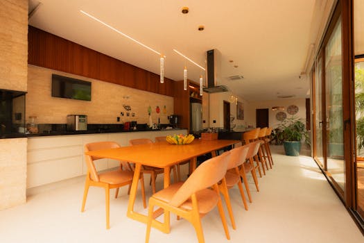 Spacious kitchen with wooden accents and natural light, ideal for luxury interiors.