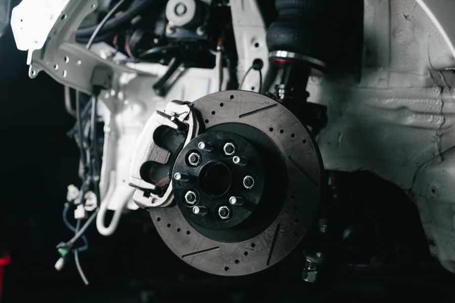 Detailed view of a vehicle's disc brake system with caliper and rotor