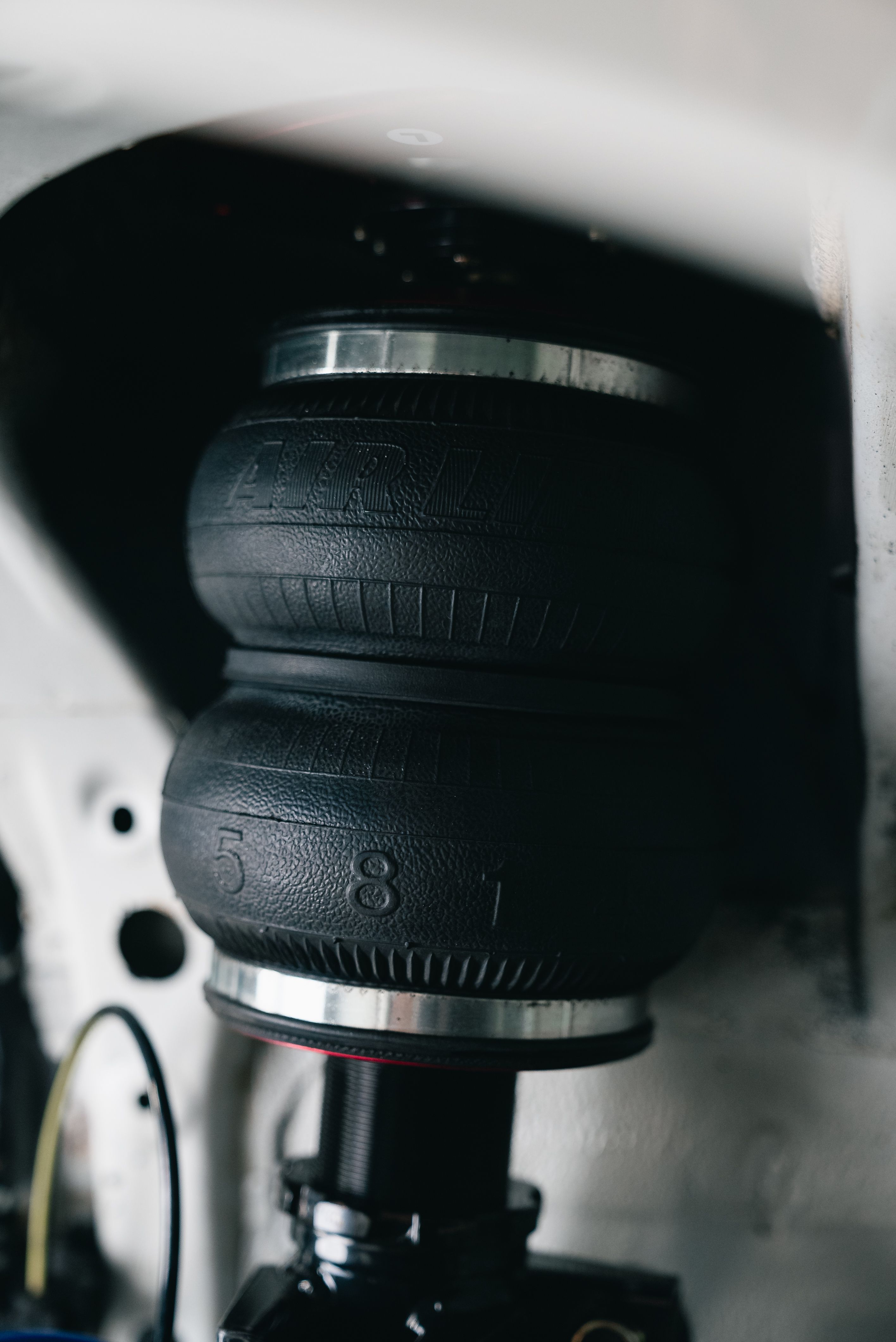 Close-Up of Car Suspension System with Air Spring · Free Stock Photo
