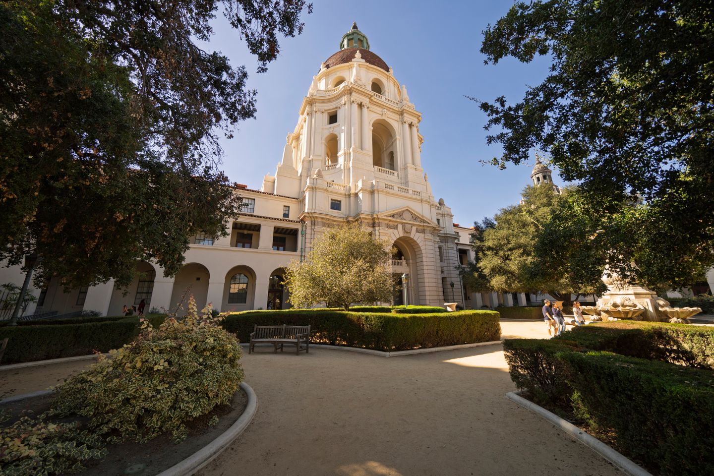 Pasadena City Hall with golden dome, manicured gardens, and clear blue sky