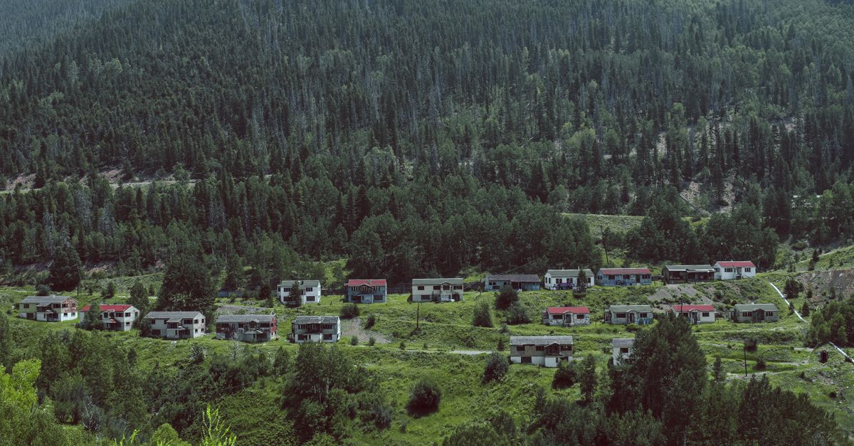 Explore the remains of an abandoned mining town nestled in a lush Colorado mountain valley.