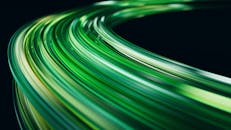 Dynamic Abstract Green Light Trails on Dark Background