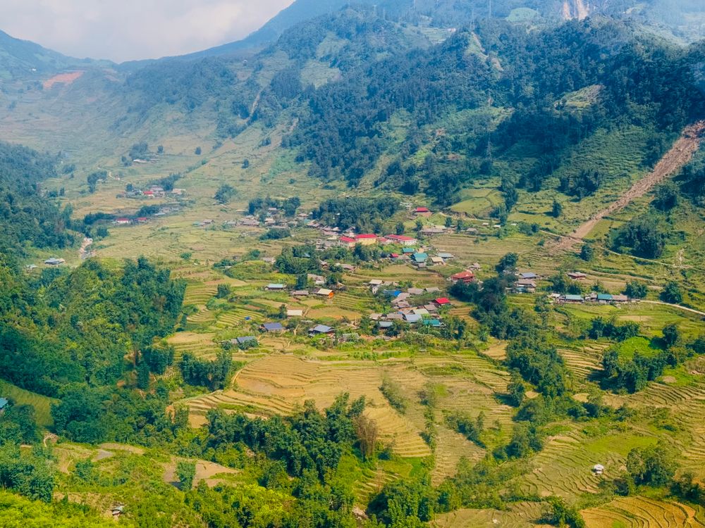Remote Rural Valley Aerial View of Rural Village in Lush Green Valley · Free Stock Photo
