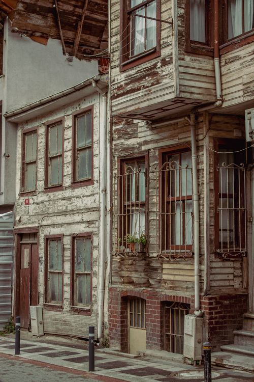 Free Charming rustic buildings with weathered textures in a quaint neighborhood setting. Stock Photo