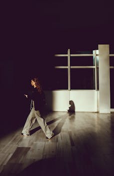 Dynamic image of a woman walking indoors in Istanbul with a strong shadow on the floor.