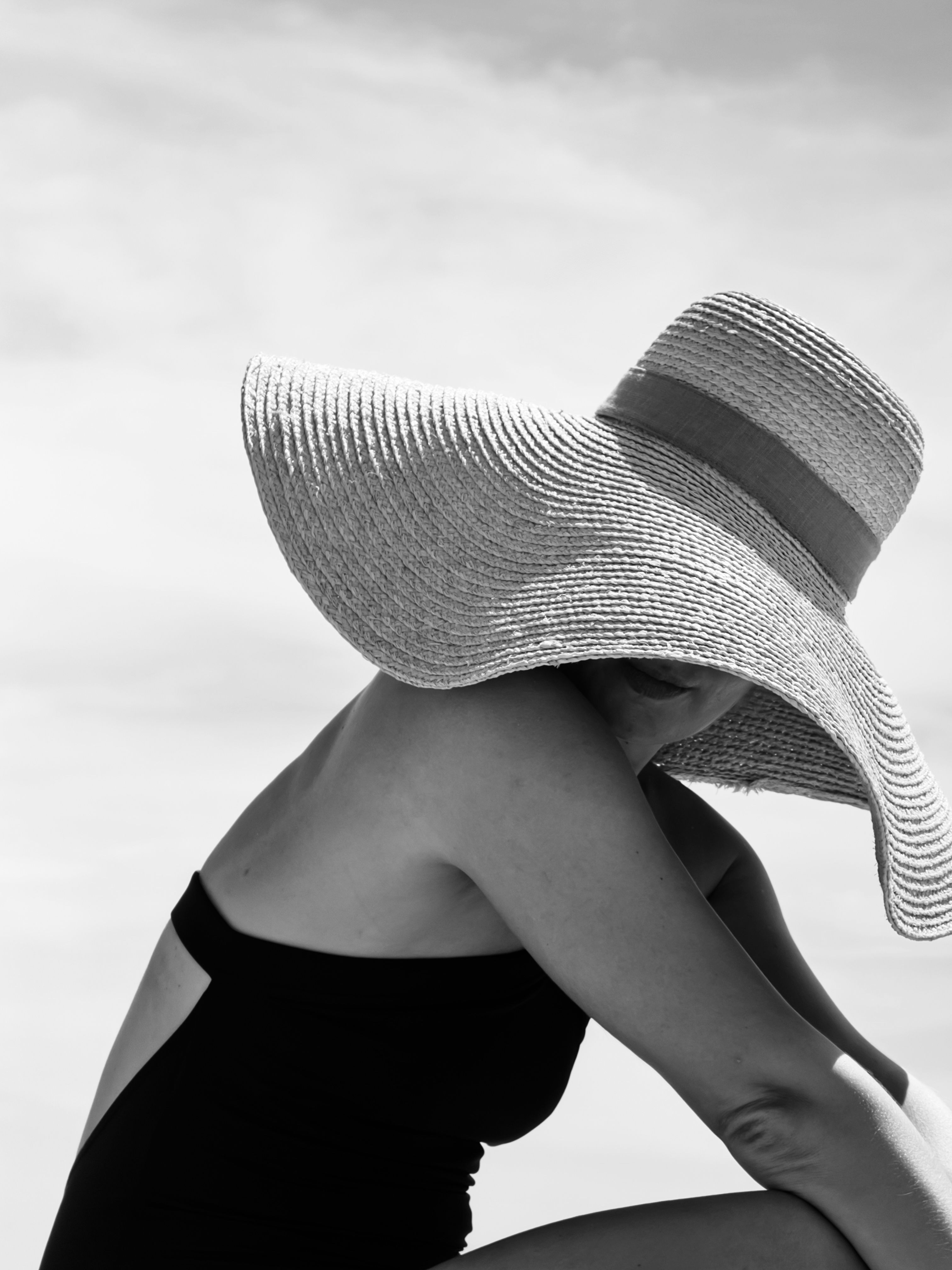 Stylish Portrait of Woman in Sun Hat on Beach · Free Stock Photo