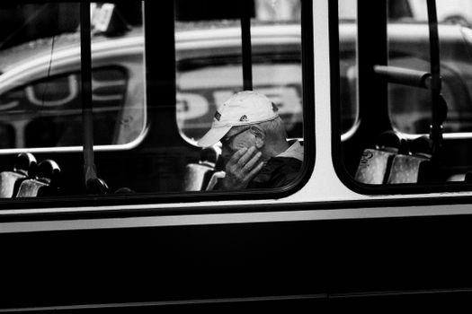 A thoughtful moment captured through a bus window in Dublin, Ireland.