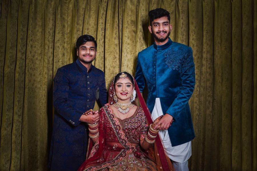 South Asian bride with her brothers in traditional attire