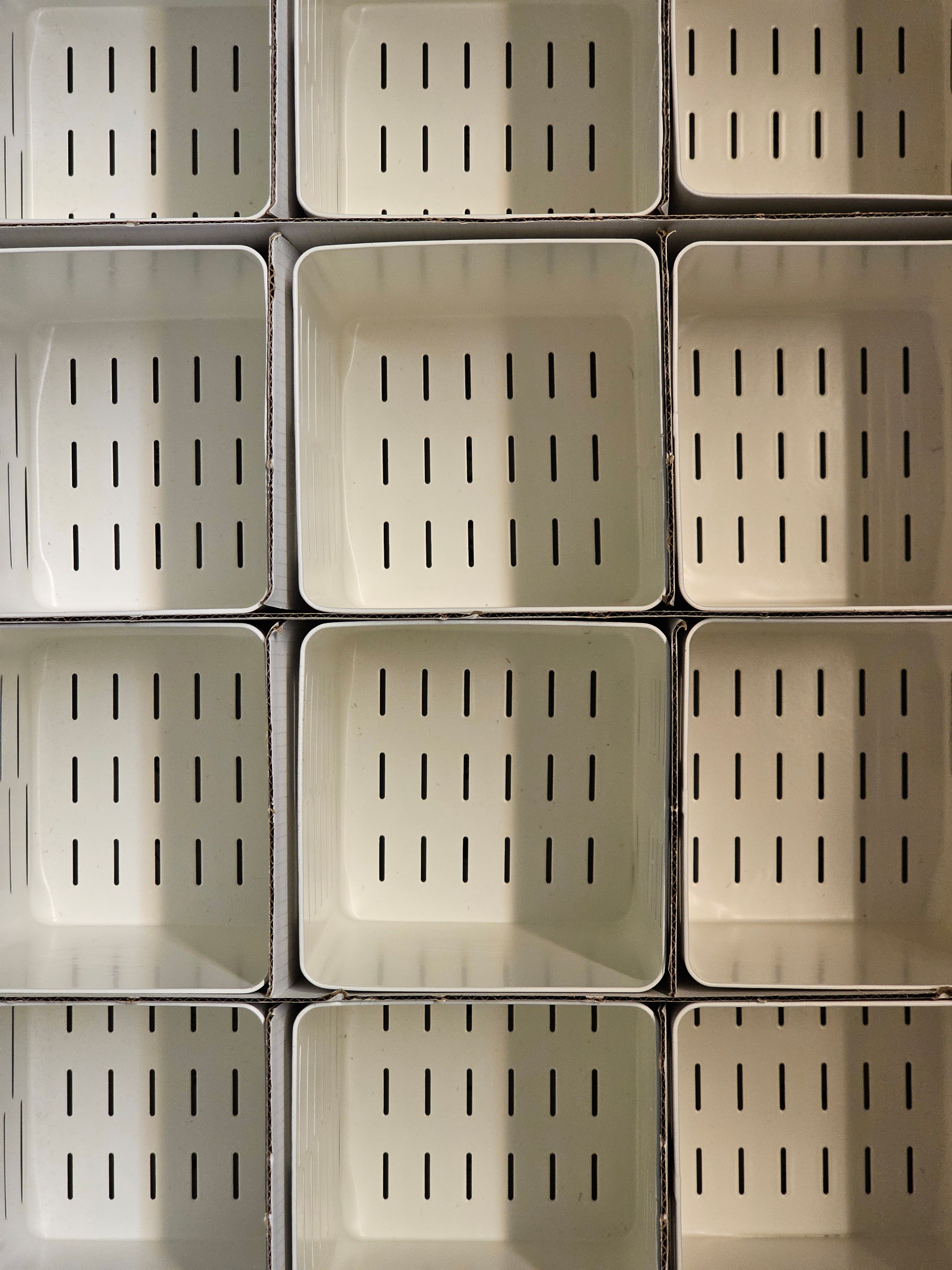 Symmetrical Pattern of White Containers · Free Stock Photo