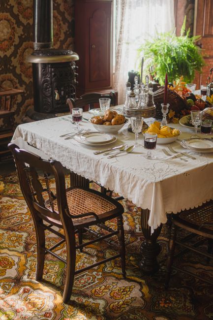 A beautifully set Victorian-style dining table in Oakville, Ontario, evoking a vintage charm.