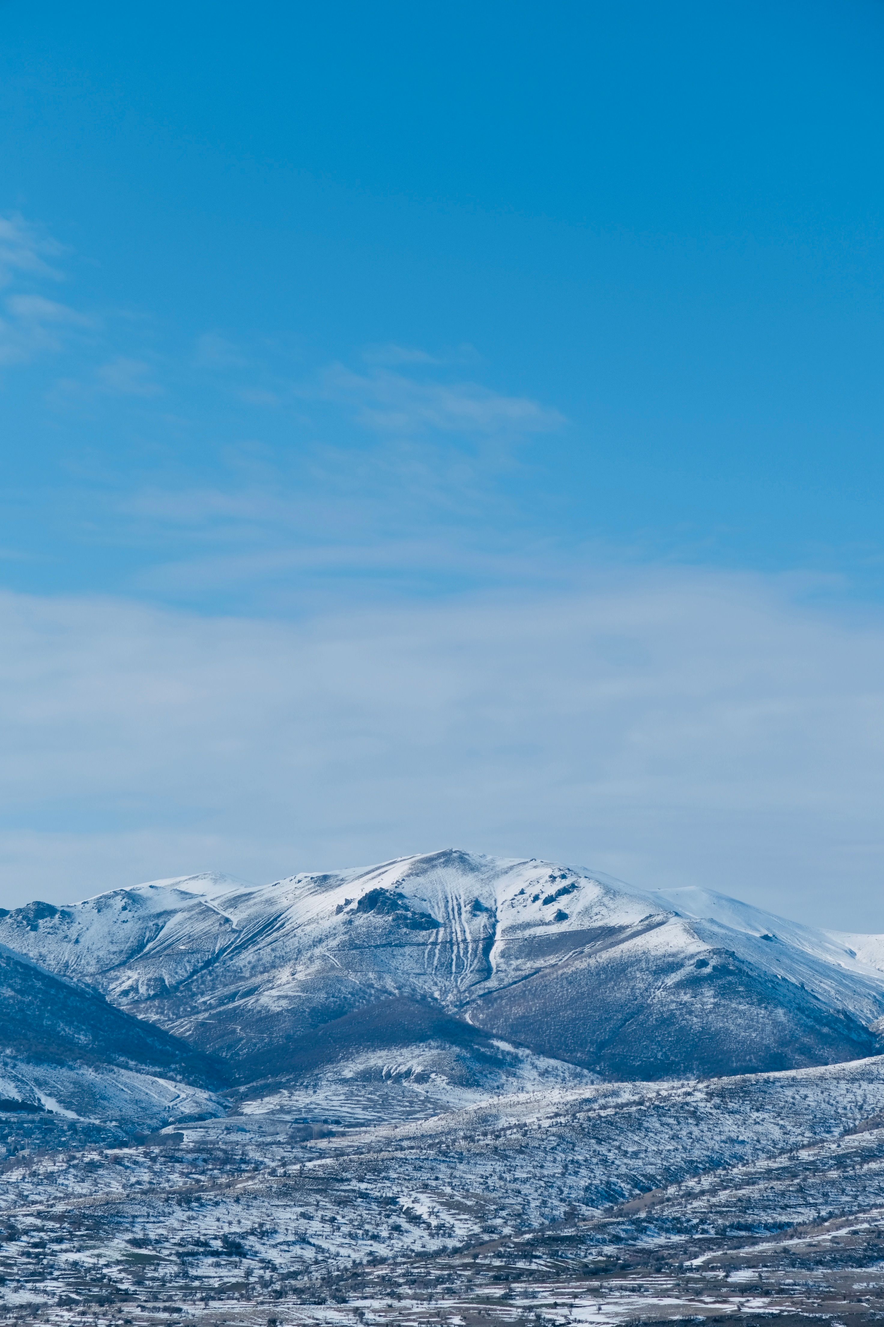 Snow-Capped Mountain Peaks under Clear Blue Sky · Free Stock Photo