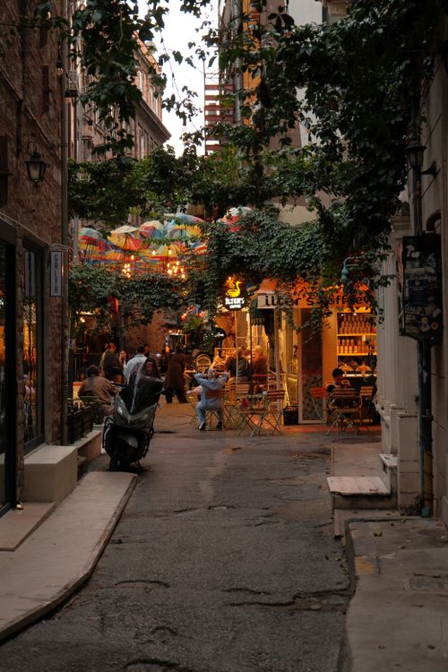 Free A picturesque alley in Karaköy, İstanbul, adorned with colorful umbrellas and vibrant cafes. Stock Photo