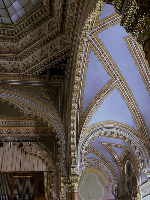 Free Elegant Gothic Revival architecture with ornate ceiling details and arches. Stock Photo