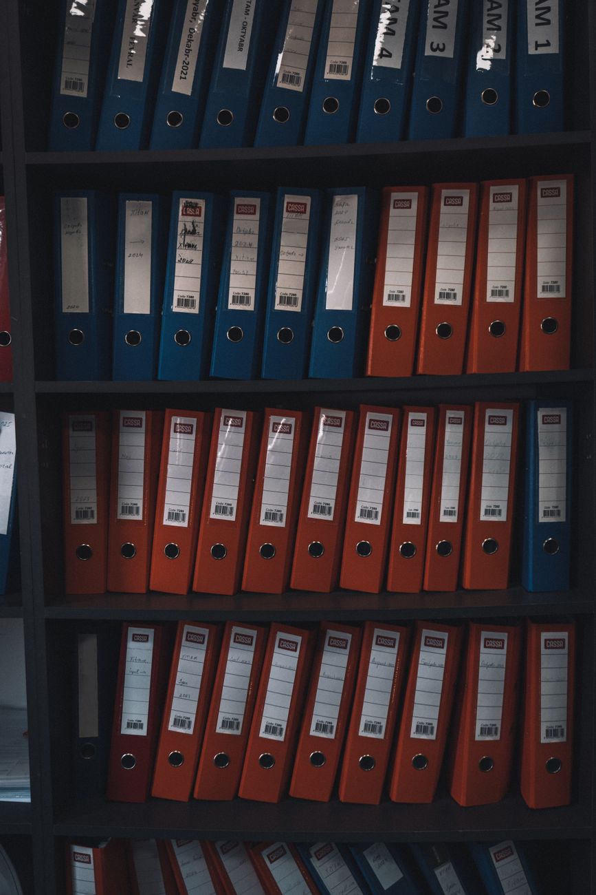 Rows of organized office file binders, representing a DocJacket alternative