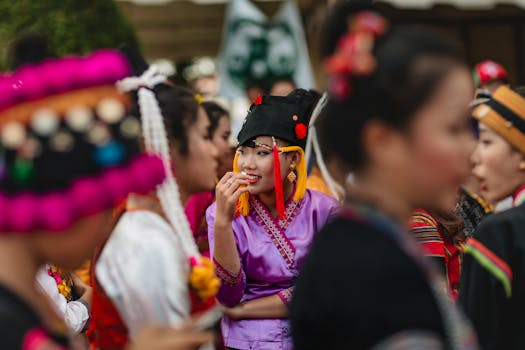Colorful festivities at an Asian festival in Vientiane, Laos, showcasing traditional attire and cultural gathering.