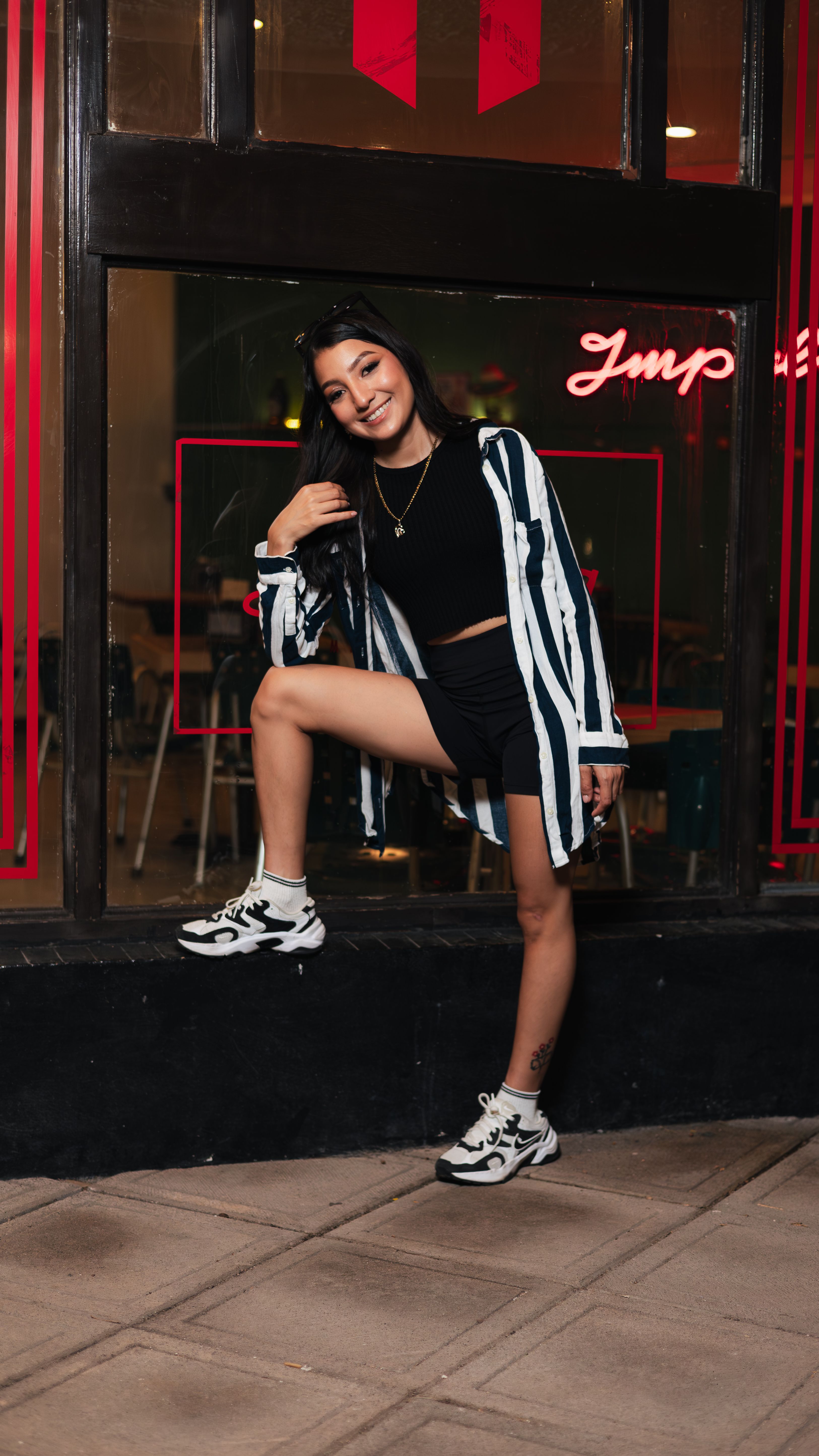Trendy Young Woman Posing Outdoors at Night · Free Stock Photo
