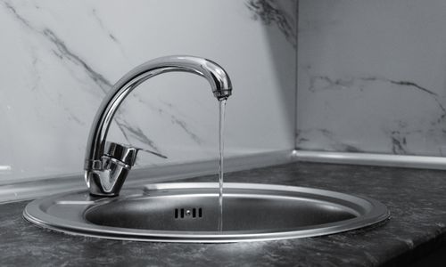 Chrome faucet with running water