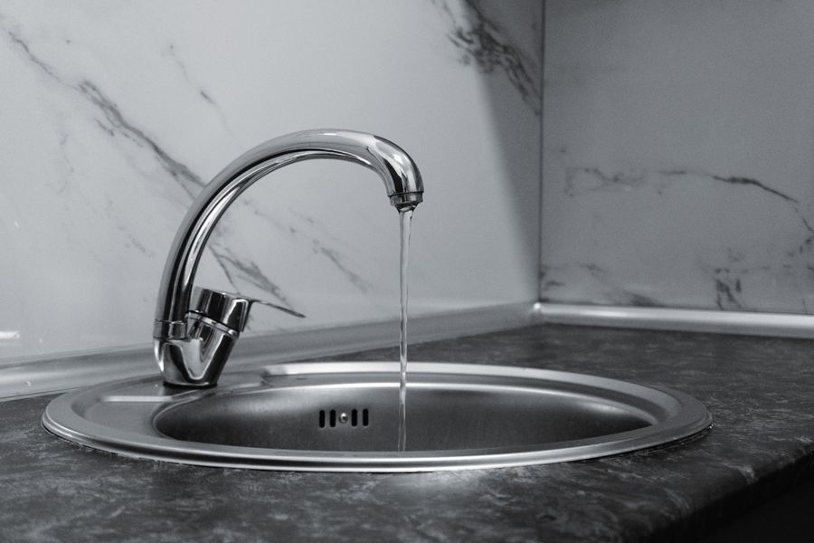 Kitchen faucet with water running — Jacksonville water quality