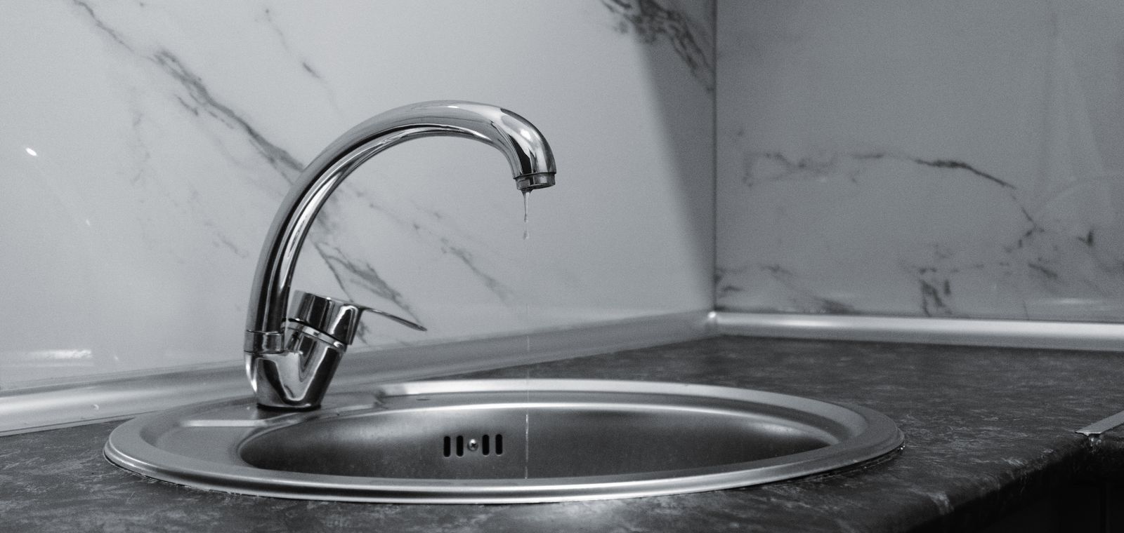 Kitchen faucet dripping water