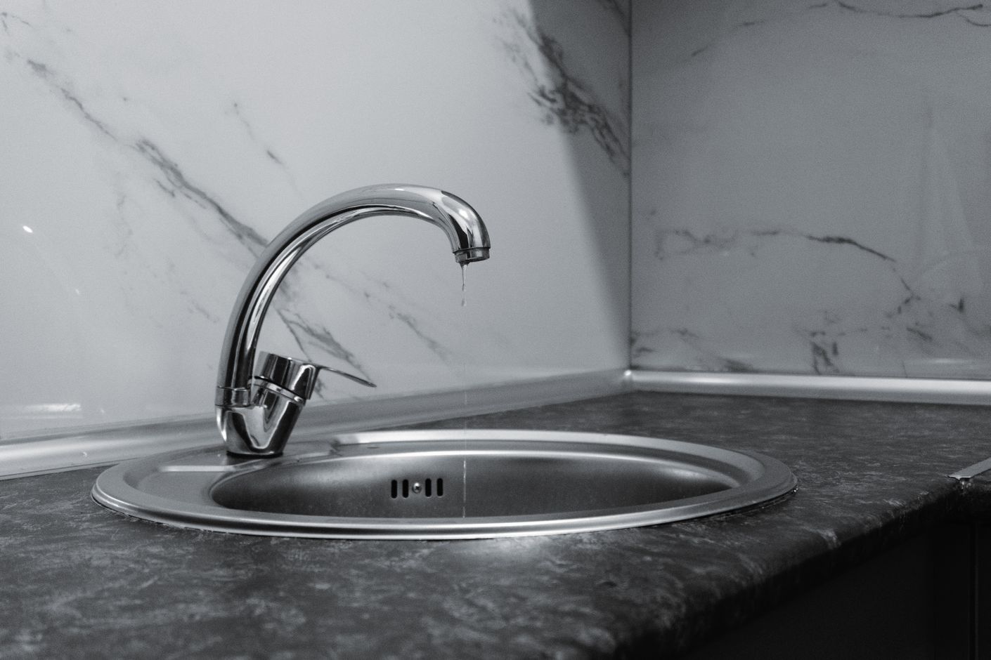 Clean and modern kitchen sink with a chrome faucet