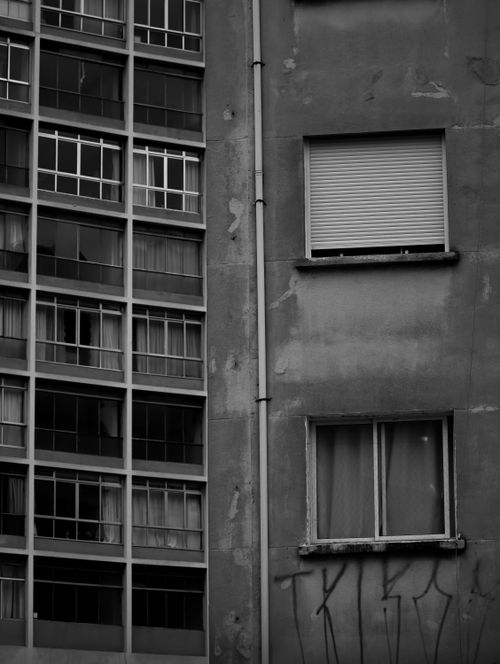 Free A striking contrast between modern and vintage building facades, highlighting urban architecture. Stock Photo