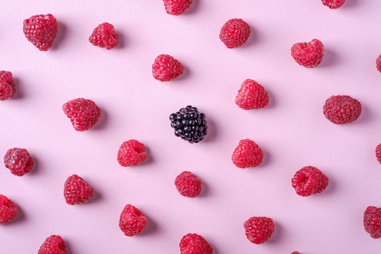 Photo Of Raspberries And Blackberry On Pink Background