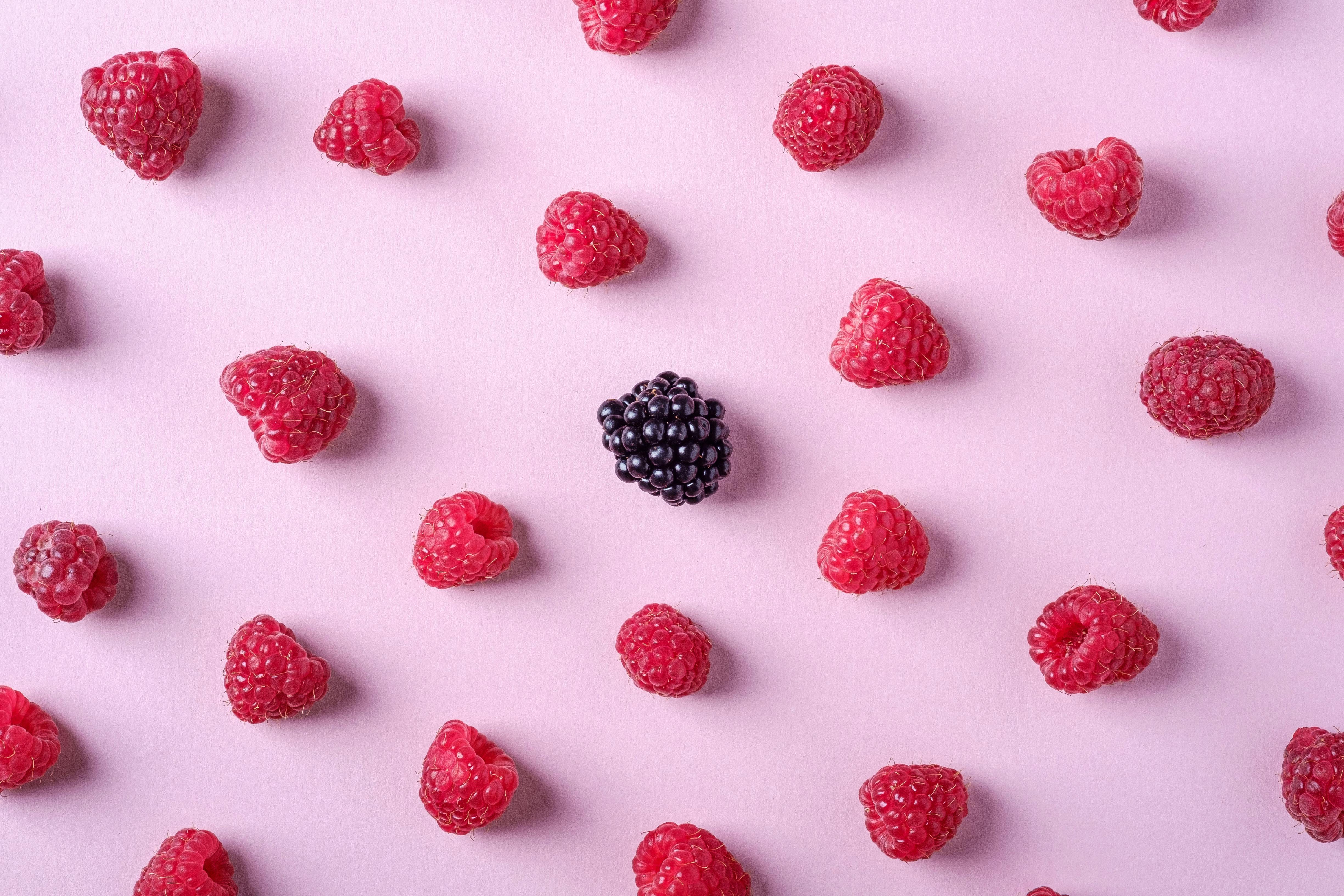 Photo Of Raspberries And Blackberry On Pink Background · Free Stock Photo