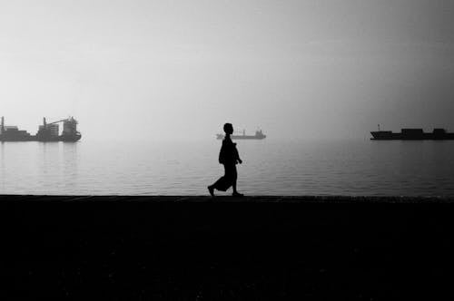 Silhouette Photo of Person Walking