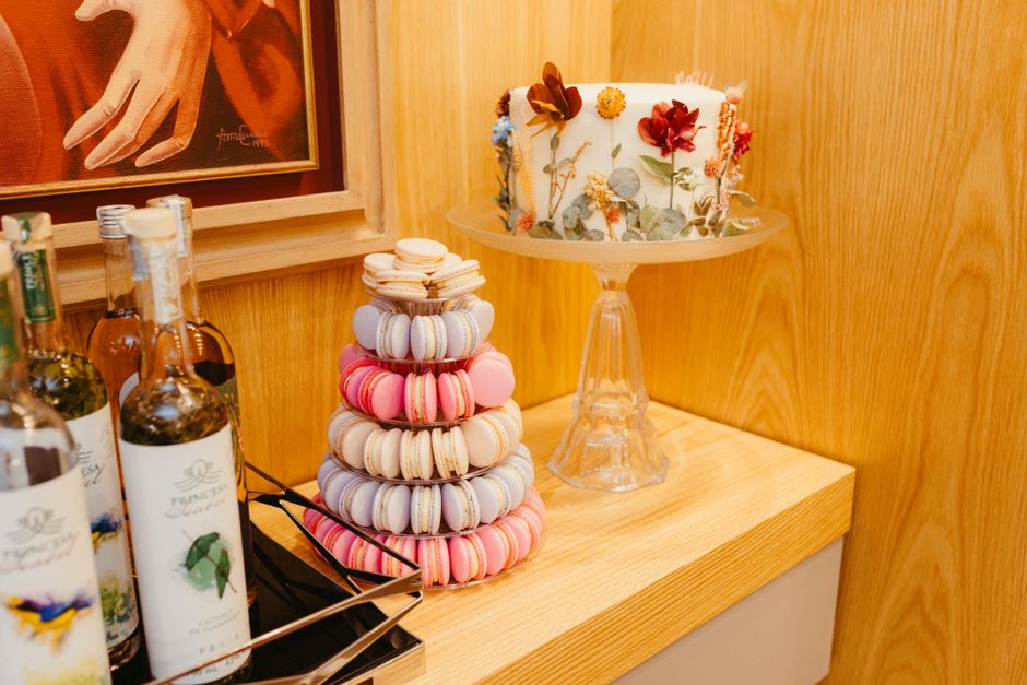 Colorful display of macarons in a Parisian patisserie like Ladurée