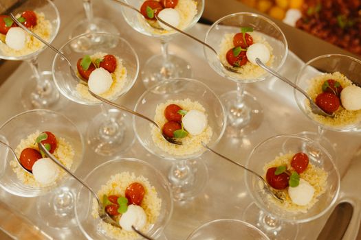 Stylish appetizers served in martini glasses showcasing gourmet presentation and culinary art.