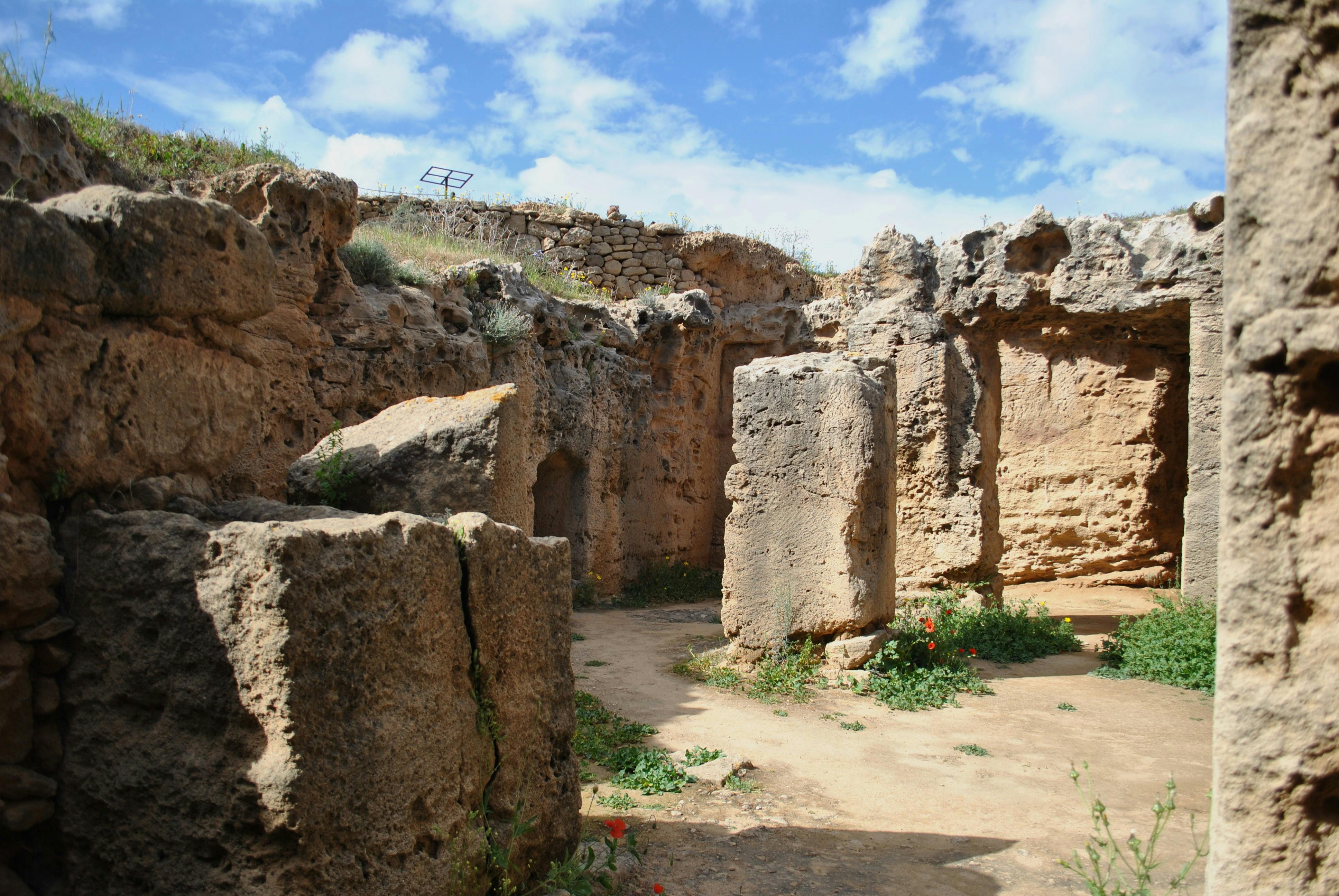 Explore ancient ruins with stone structures under a vibrant sky.