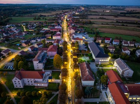 Scenic aerial view of Garešnica's illuminated streets at dusk in Croatia.