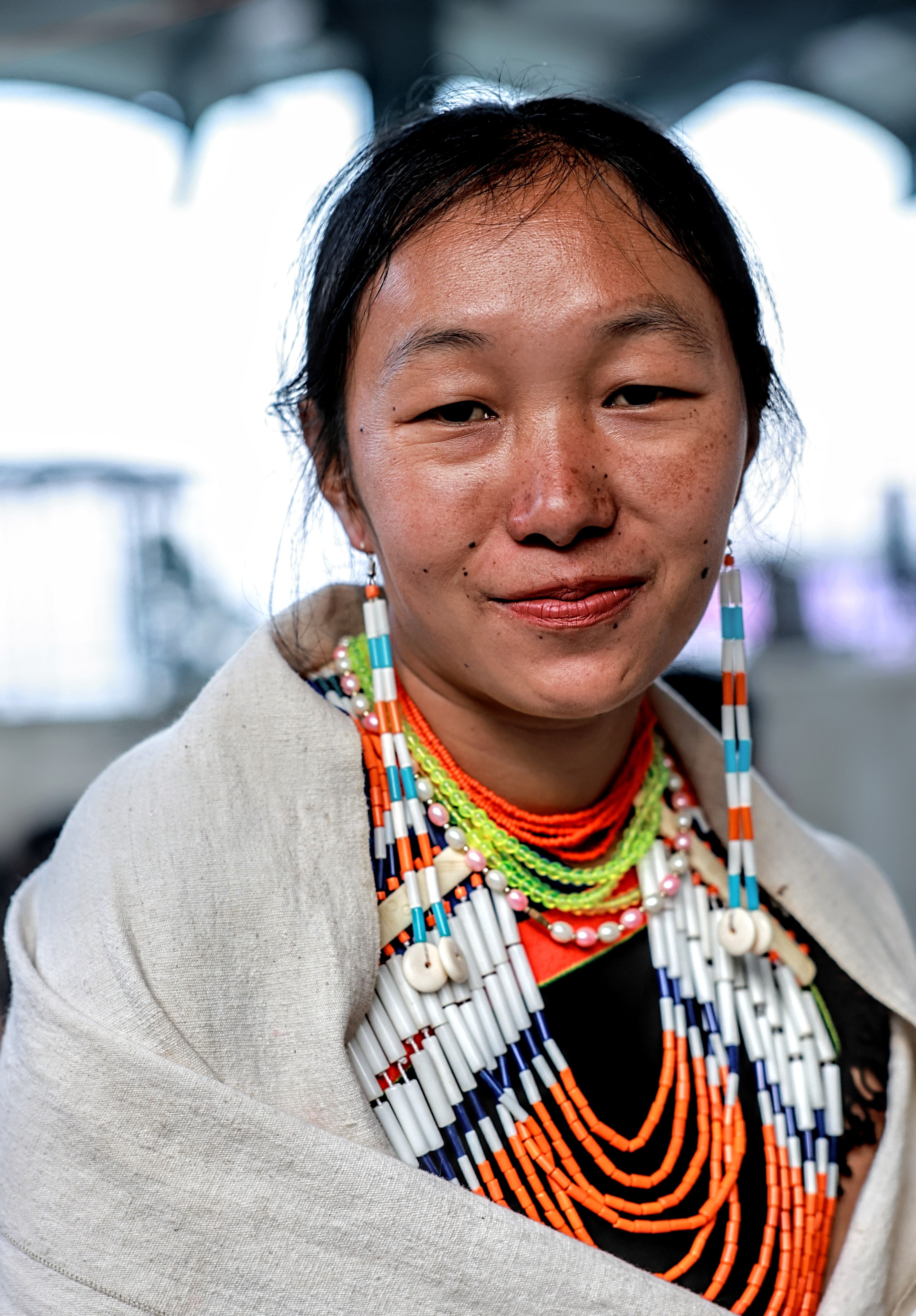Smiling Woman in Traditional Naga Attire  Free Stock Photo