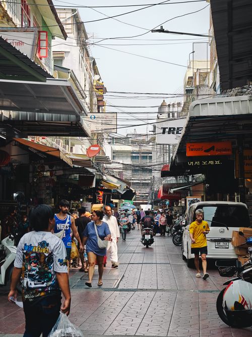 Free Crowded Street in Bangkok with Pedestrians and Motorcycles Stock Photo
