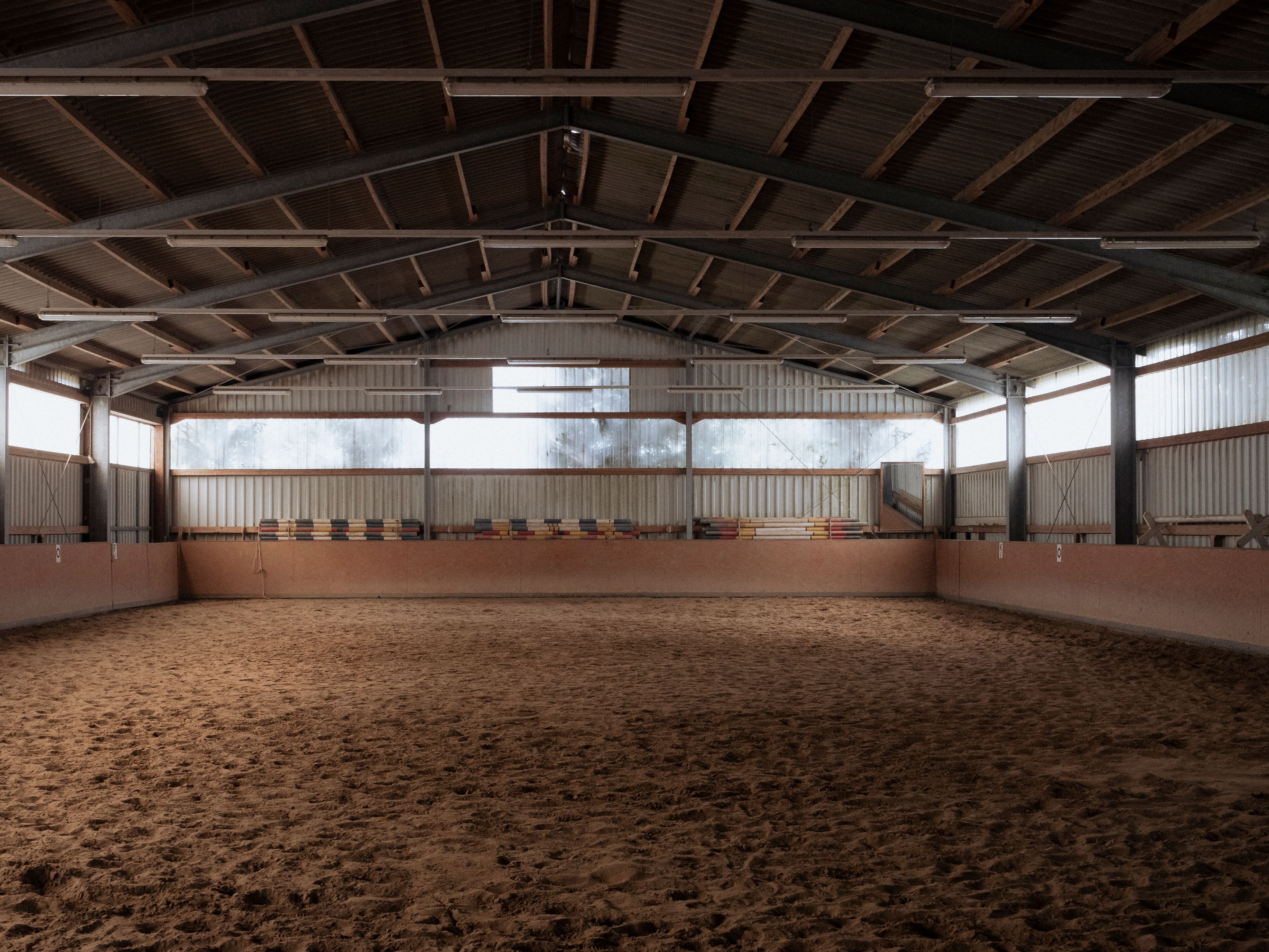 Spacious Indoor Horse Riding Arena Interior · Free Stock Photo