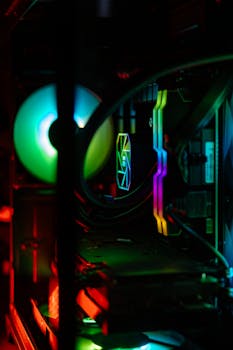 A close-up of a custom RGB gaming PC featuring vibrant lighting and liquid cooling.