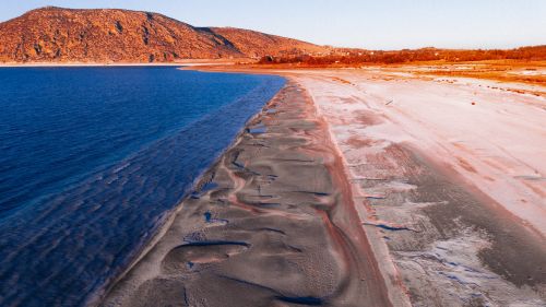 Free A breathtaking aerial view of Salda Lake with vibrant colors during golden hour. Stock Photo