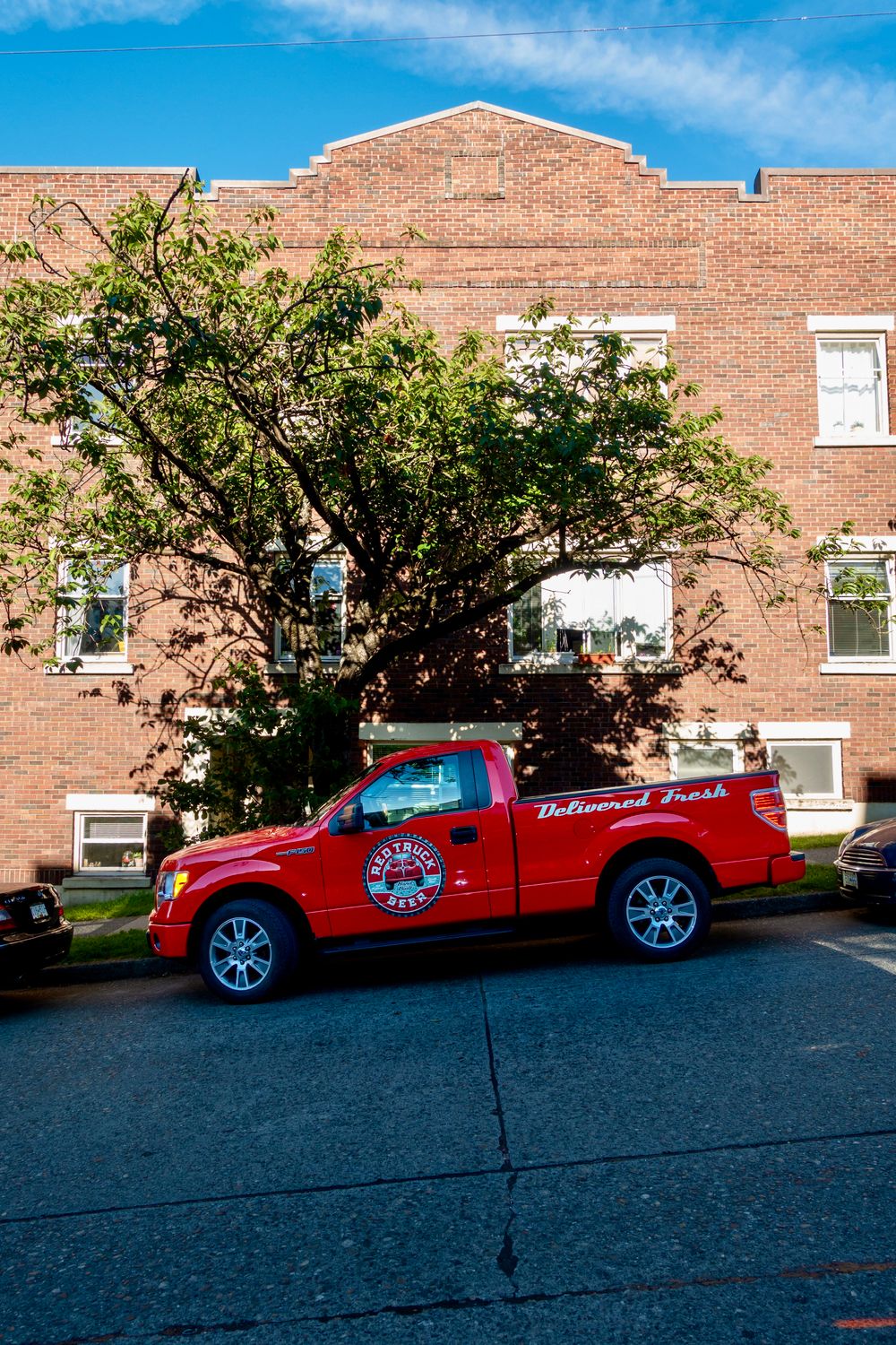 Red Loop Delivery Red Delivery Truck on Vancouver Street · Free Stock Photo