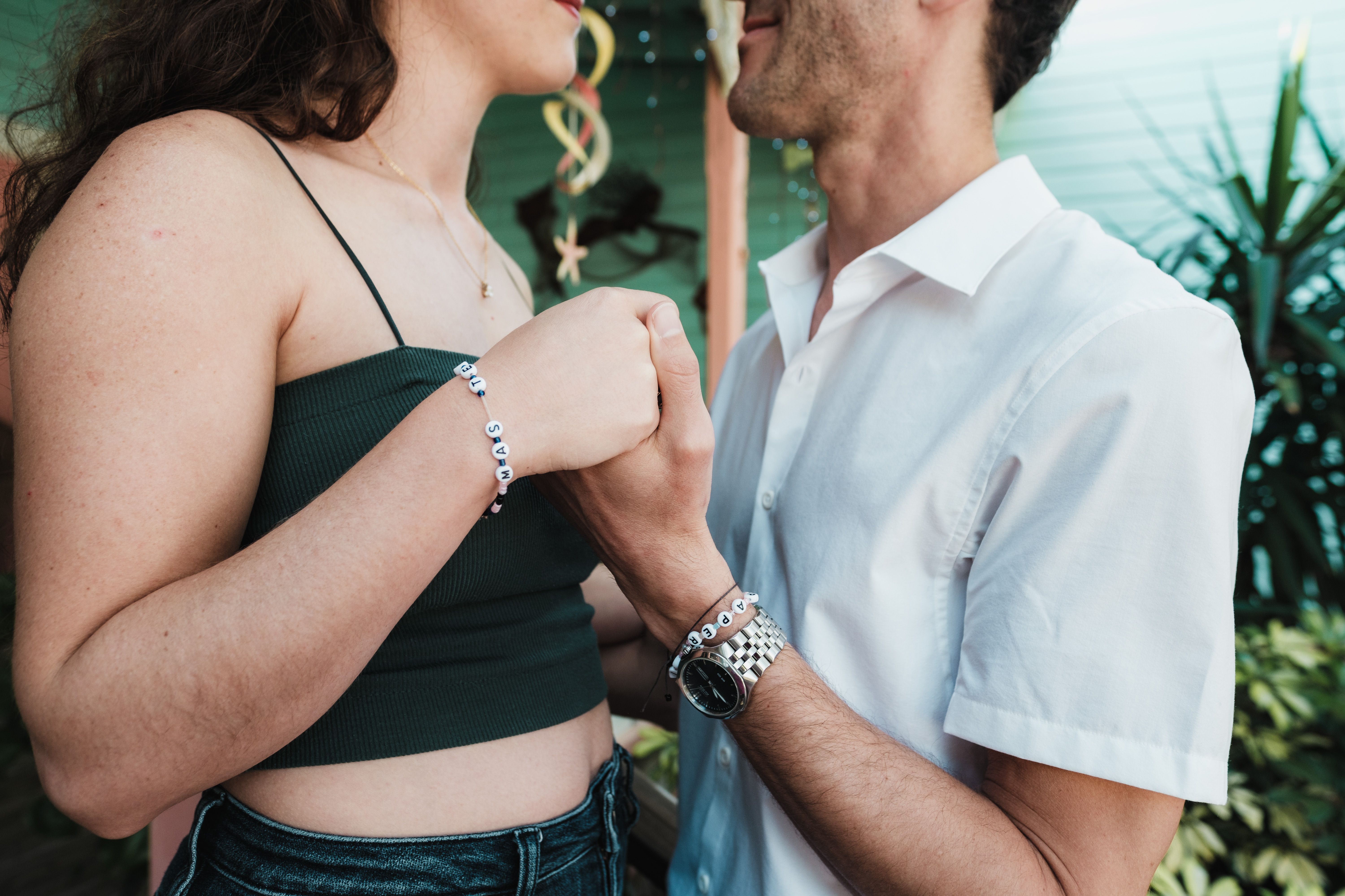 Romantic Couple Holding Hands Outdoors · Free Stock Photo