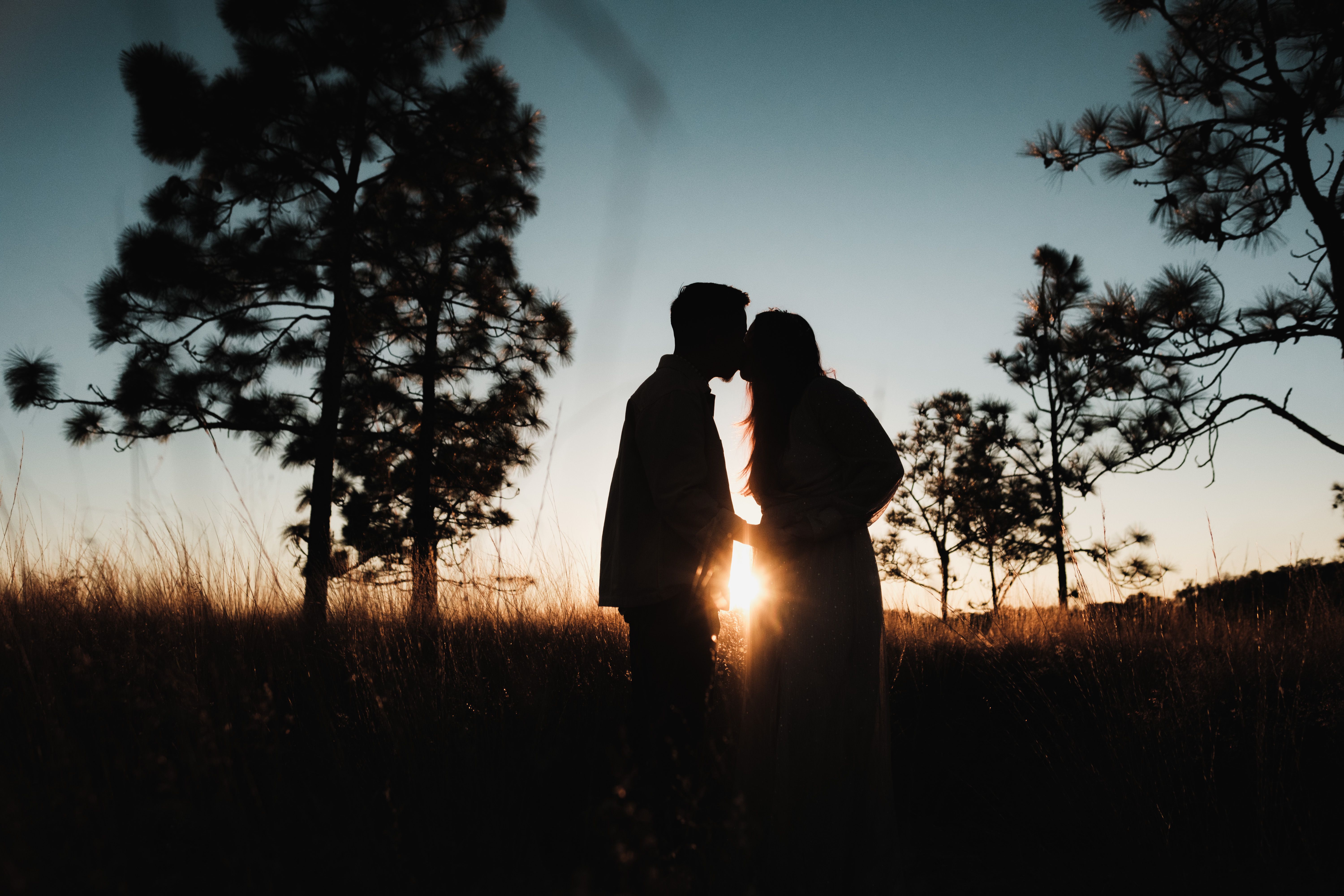 Romantic Silhouette of a Couple at Sunset · Free Stock Photo