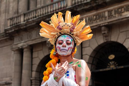 Free Vibrant Day of the Dead celebration with traditional face paint in Mexico City, CDMX. Stock Photo