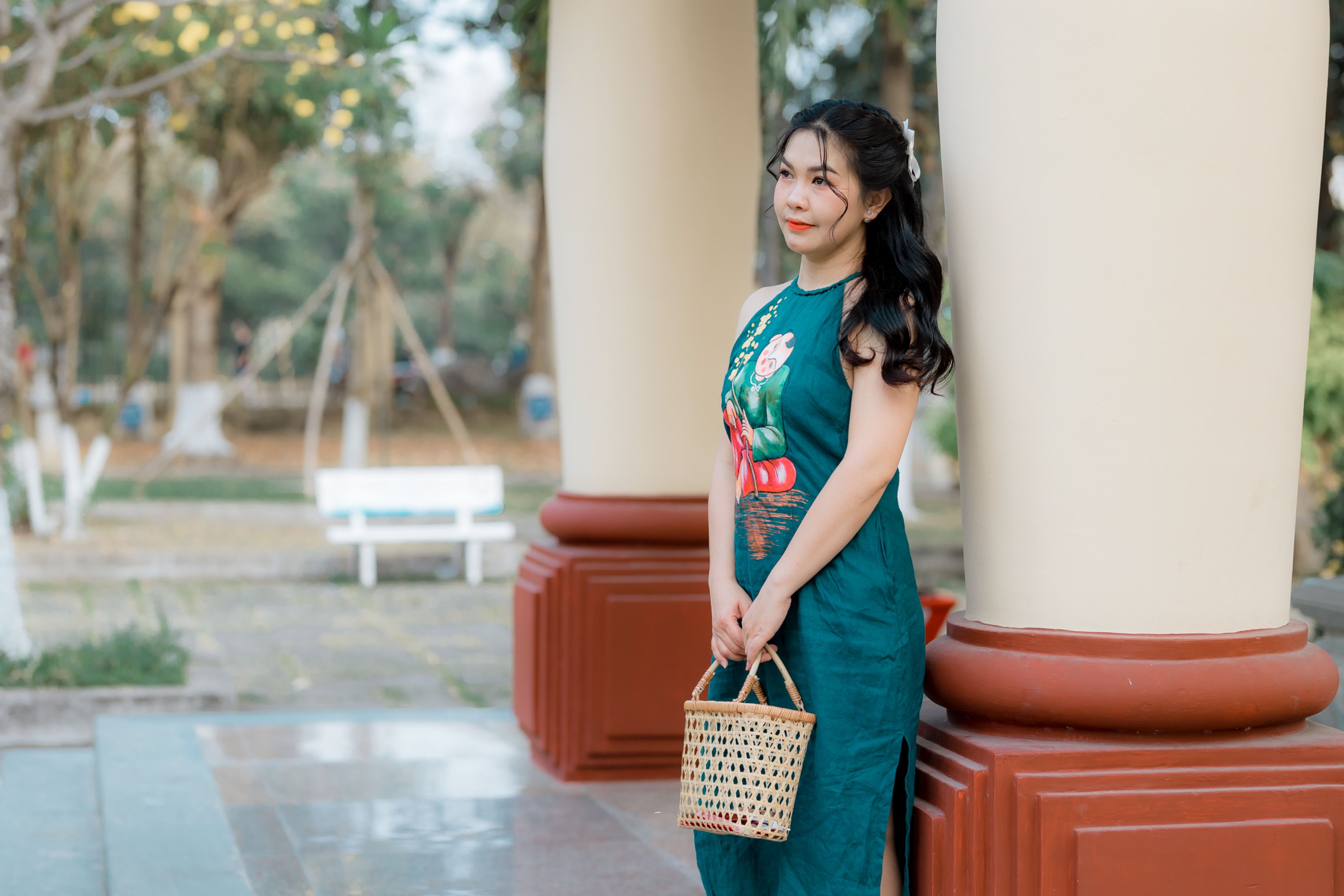 Elegant Woman in Green Dress Standing Outdoors · Free Stock Photo