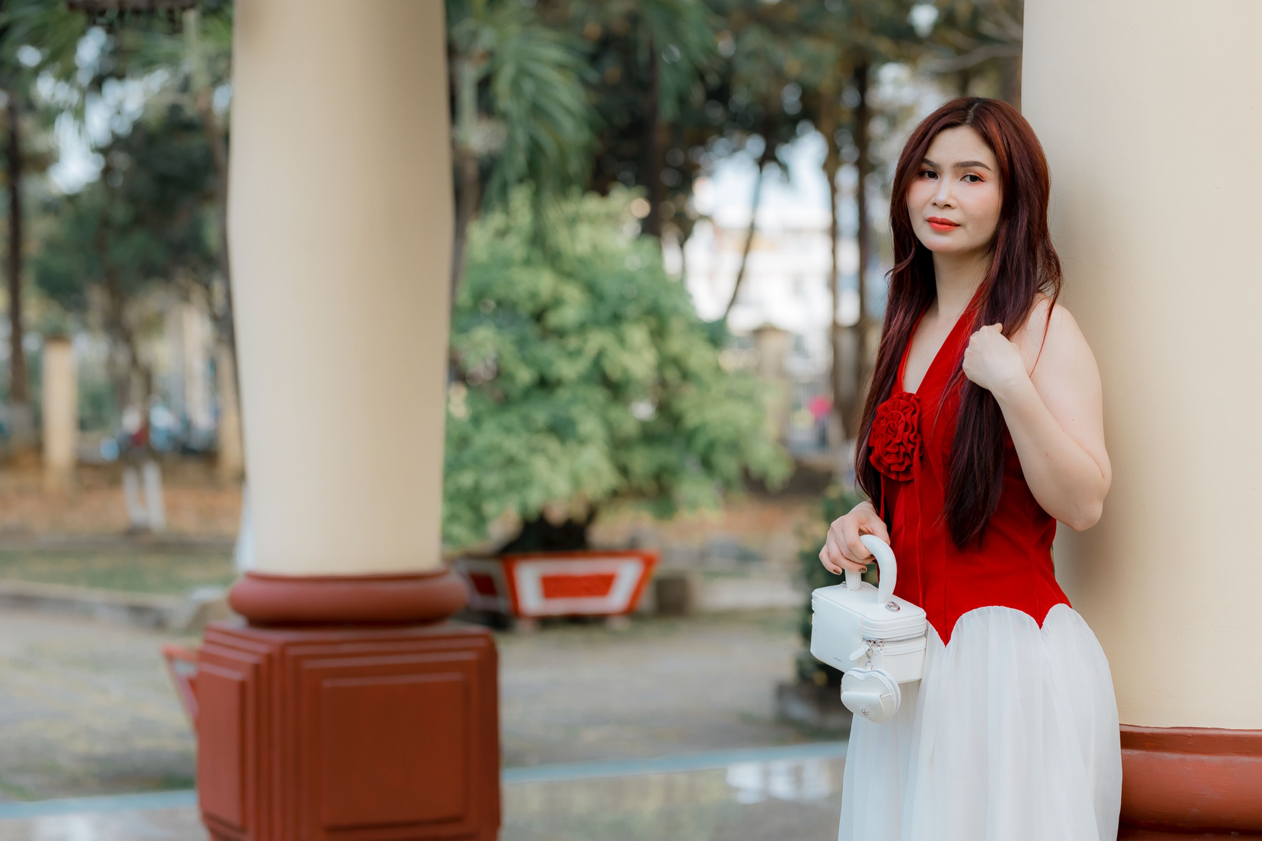 Elegant Woman in Red and White Dress Outdoors · Free Stock Photo