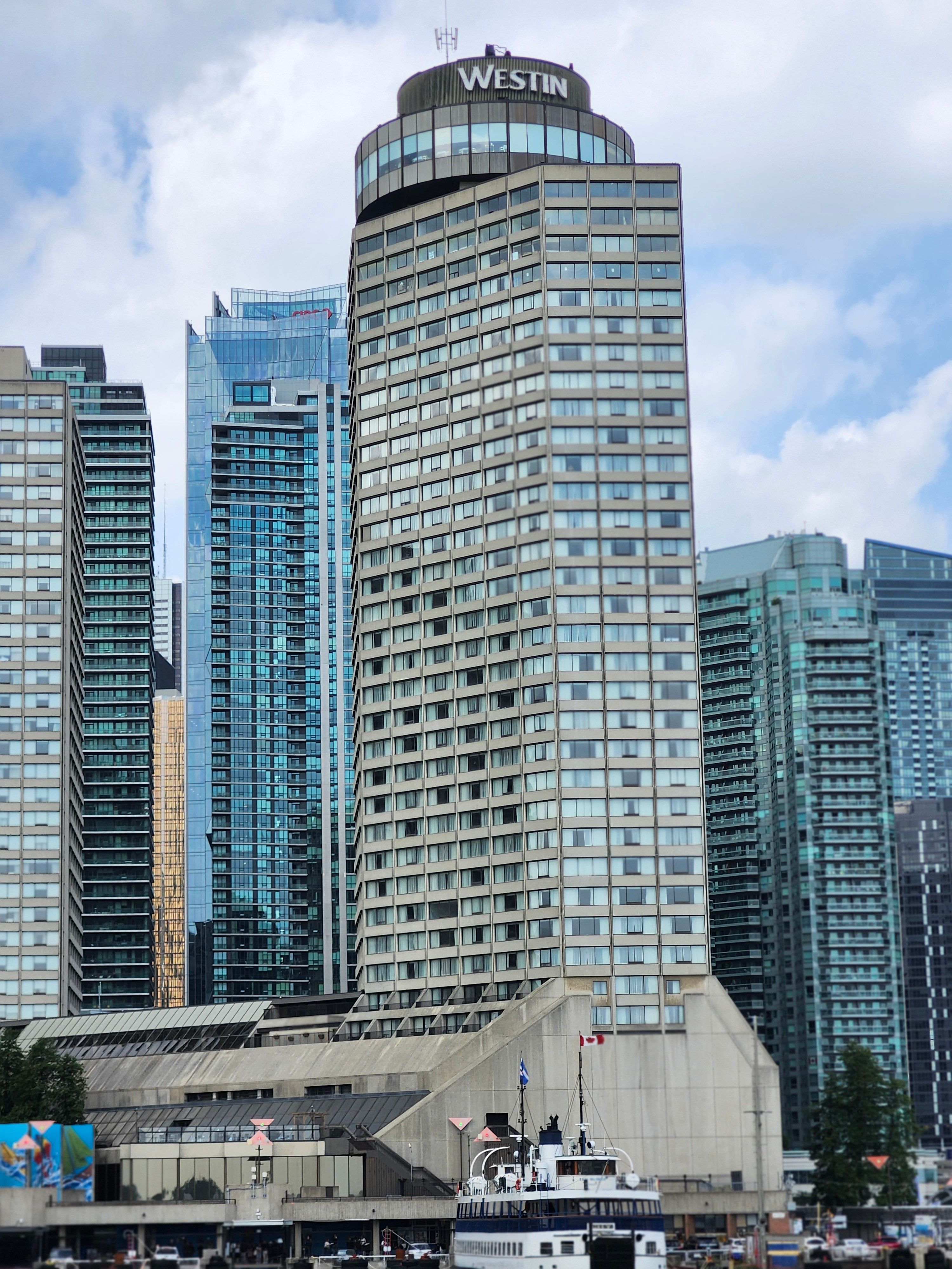 View of the modern high-rise skyline and iconic Westin Harbour Castle in downtown Toronto.
